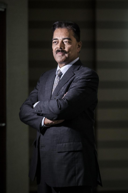 Vimal Shah, chairman of Bidco Africa Ltd., poses for a photograph following a Bloomberg Television interview at the Bidco Headquarters in Thika, Kenya, on Wednesday, Aug. 29, 2018. China's modern-day adaptation of the Silk Road, known as the Belt and Road Initiative, aims to revive and extend trading routes connecting China with Central Asia, the Middle East, Africa and Europe via networks of upgraded or new railways, ports, pipelines, power grids and highways. Photographer: Luis Tato/Bloomberg © 2018 BLOOMBERG FINANCE LP