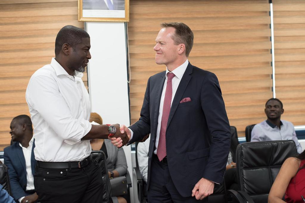 Kevin Okyere in a handshake with a Stena Drilling executive after signing the contract SPRINGFIELD GROUP