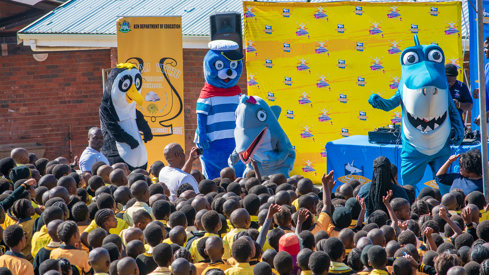 Mascots Deliver Shoes To Learners
